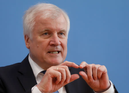 German Interior Minister and Christian Social Union (CSU) leader Horst Seehofer gestures as he speaks to the media after Bavaria election loss, in Berlin, Germany, October 16, 2018. REUTERS/Michele Tantussi