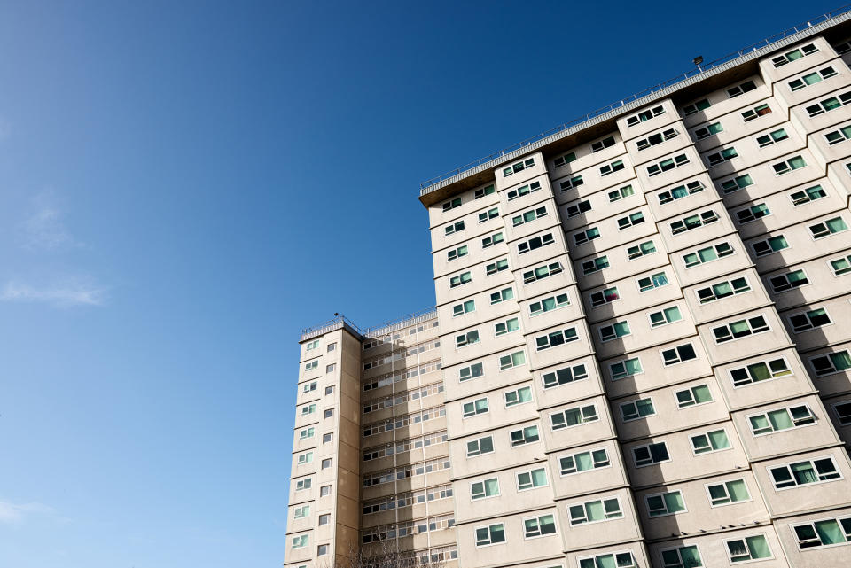 Apartment unit block used by the welfare and housing government agencies to house the needy and less fortunate in society shot against the blue sky of a sunny day.