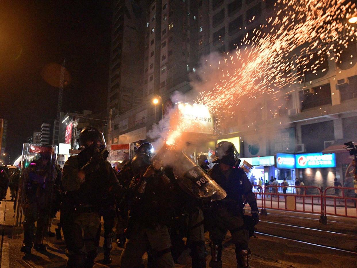 Riot police officers shoot tear gas canisters against pro-democracy protesters in Hong Kong on September 21, 2019: AFP/Getty