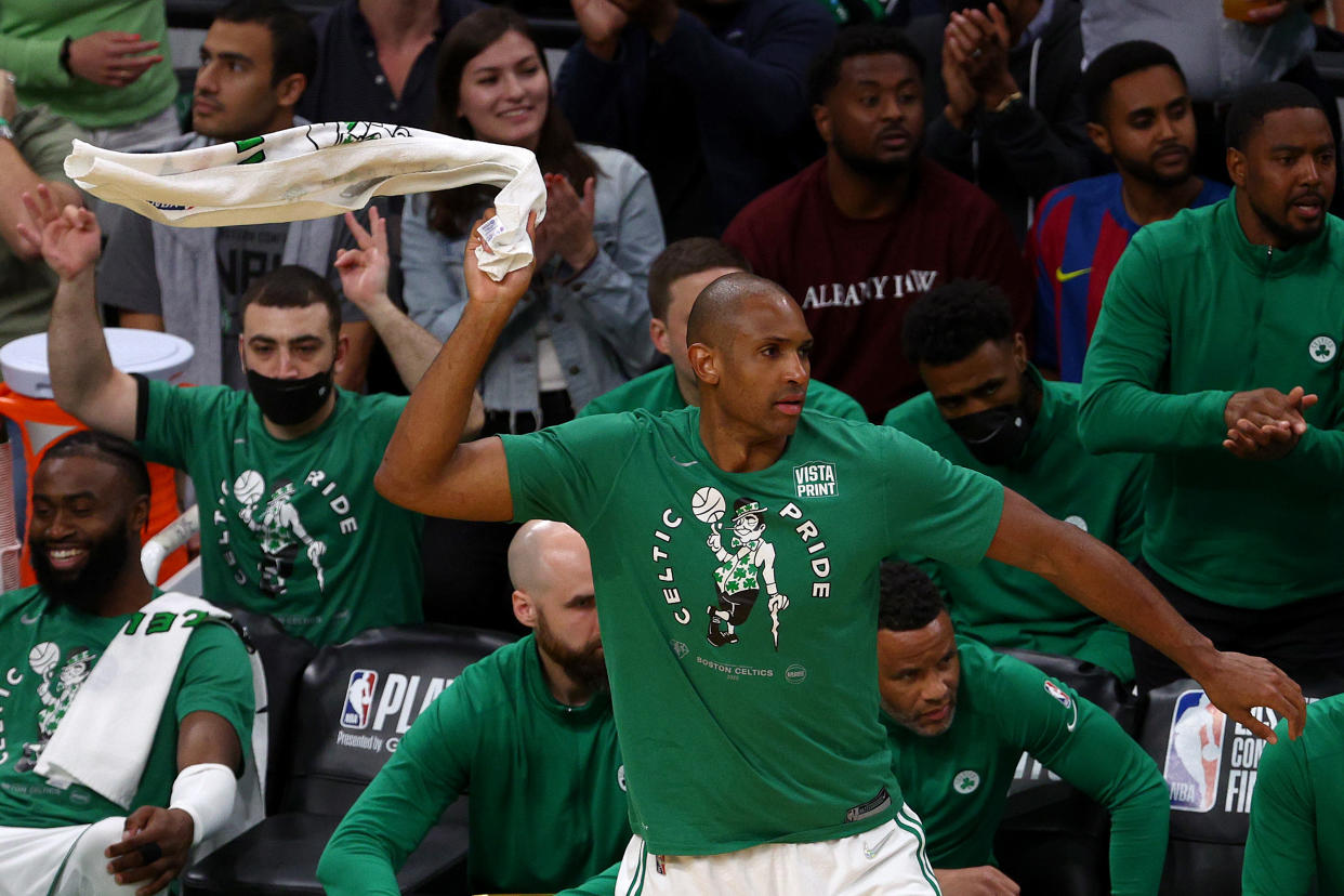 Al Horford celebrates from the bench during his Boston Celtics' blowout victory against the Miami Heat in Game 4 of the Eastern Conference finals. (Elsa/Getty Images)