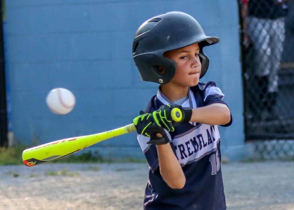 Tremblay Bus outfielder Landen Morro watches a high fastball pass by during an at bat in recent action at Whaling City Youth Baseball in New Bedford's North End.