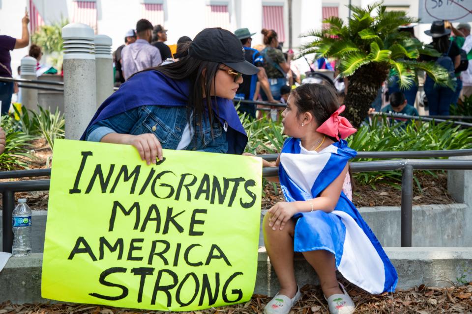 Protestors in Florida oppose a bill targeting undocumented immigrants in that state. Proponents of a Kansas law designed to combat human smuggling have tried to quell anxiety that it could be used to target immigrants.