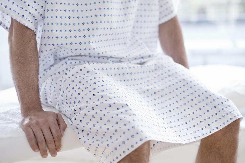 A patient sitting on a bed