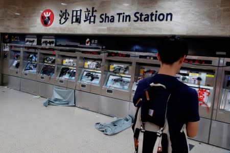 Damaged ticket machines are seen inside Sha Tin MTR station after an anti-government rally at New Town Plaza at Sha Tin, Hong Kong