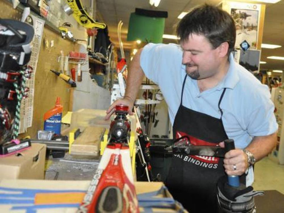 Valley Sporting Goods owner Darren Daily tests the release of a customer’s ski binding during business hours. (BRIAN RAMSAY/bramsay@modbee.com)