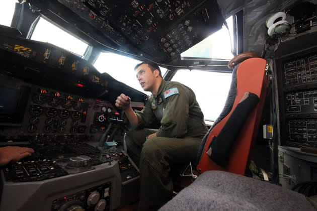 A member of the Royal Australian Air Force pilots a plane involved in the search for Malaysia Airlines flight MH370. (Getty Images)