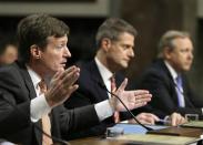 (L-R) Credit Suisse officials CEO Brady Dougan, Robert Shafir and Hans Urlich-Mesiter testify before the Senate Homeland and Governmental Affairs Investigations Subcommittee on Capitol Hill in Washington February 26, 2014. REUTERS/Gary Cameron
