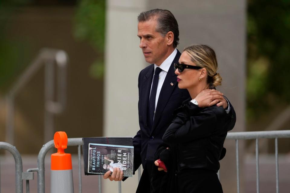 Hunter Biden, left, departs from federal court with his wife, Melissa Cohen Biden on June 5 (AP)