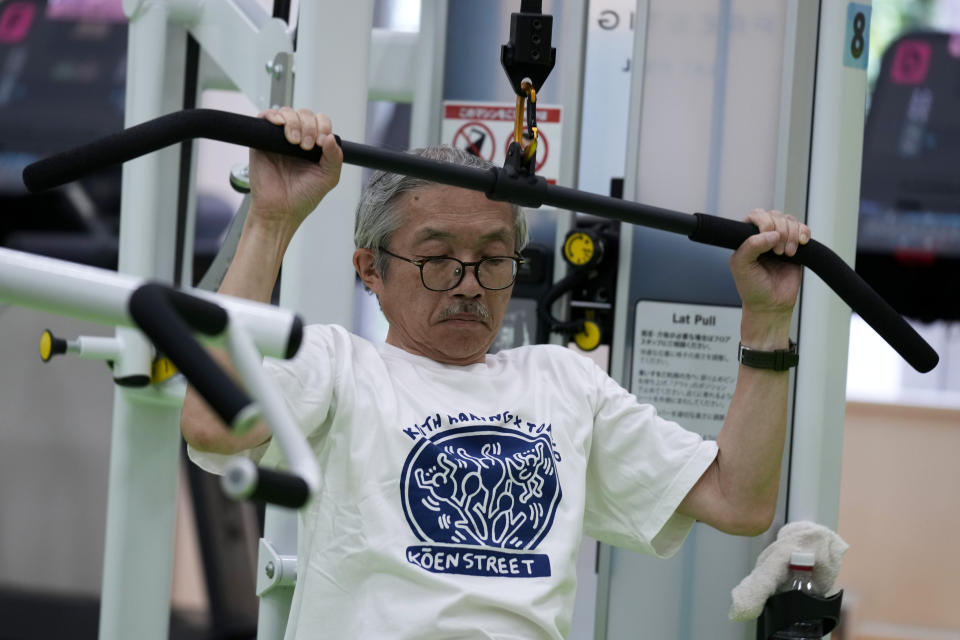 Toshiyuki Honma, 70, uses a lat pulldown machine as he works out at the Fukagawa Sports Center in Tokyo, Wednesday, June 12, 2024. If you are getting up there in years, weight-resistance training might deliver unexpected benefits. (AP Photo/Hiro Komae)