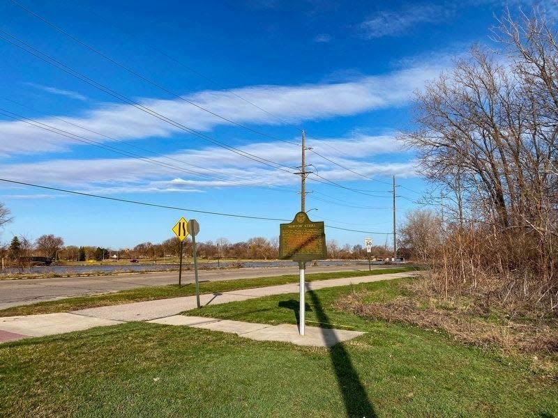 This clear-day photo shows the current placement of the Newton Steel historical marker, located on East Elm Avenue west of the I-75 Detroit-Toledo Expressway ramp. It is viewable on the right when traveling west.