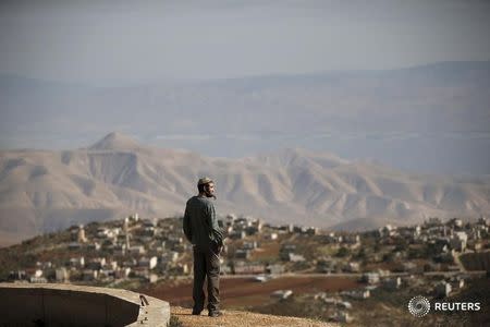 Jewish settler Refael Morris stands at an observation point overlooking the West Bank village of Duma, near Yishuv Hadaat, an unauthorised Jewish settler outpost January 5, 2016. REUTERS/Ronen Zvulun