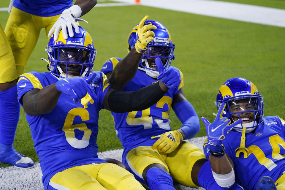 Los Angeles Rams cornerback Derion Kendrick (6) celebrates with Russ Yeast II (43) and Cobie Durant (14) after Kendrick's fumble recovery during the first half of a preseason NFL football game against the Houston Texans Friday, Aug. 19, 2022, in Inglewood, Calif. (AP Photo/Ashley Landis )