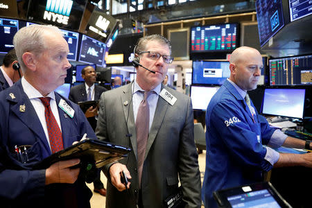 Traders work on the floor of the New York Stock Exchange (NYSE) in New York, U.S., October 13, 2017. REUTERS/Brendan McDermid