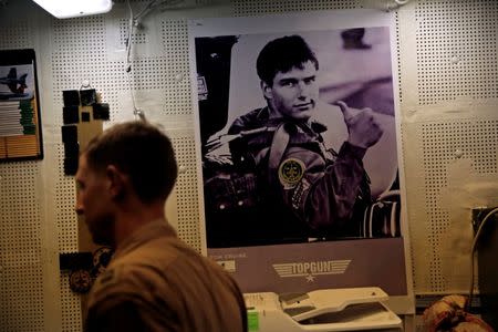 A pilot waits in his squadron room on board the USS Harry S. Truman aircraft carrier in the eastern Mediterranean Sea, June 14, 2016. REUTERS/Baz Ratner