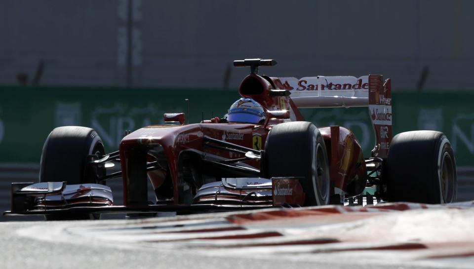 Ferrari Formula One driver Fernando Alonso of Spain drives during the third practice session of the Abu Dhabi F1 Grand Prix at the Yas Marina circuit on Yas Island, November 2, 2013. REUTERS/Caren Firouz (UNITED ARAB EMIRATES - Tags: SPORT MOTORSPORT F1)