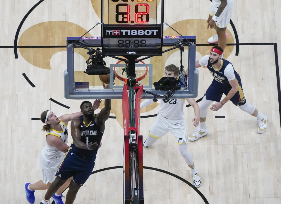 New Orleans Pelicans forward Zion Williamson (1) goes to the basket against Utah Jazz forward Kelly Olynyk (41) in the first half of an NBA basketball game in New Orleans, Thursday, Dec. 28, 2023. (AP Photo/Gerald Herbert)