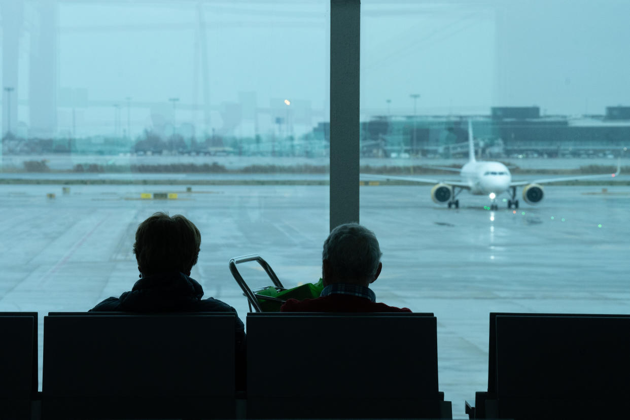 Two people in an airport.