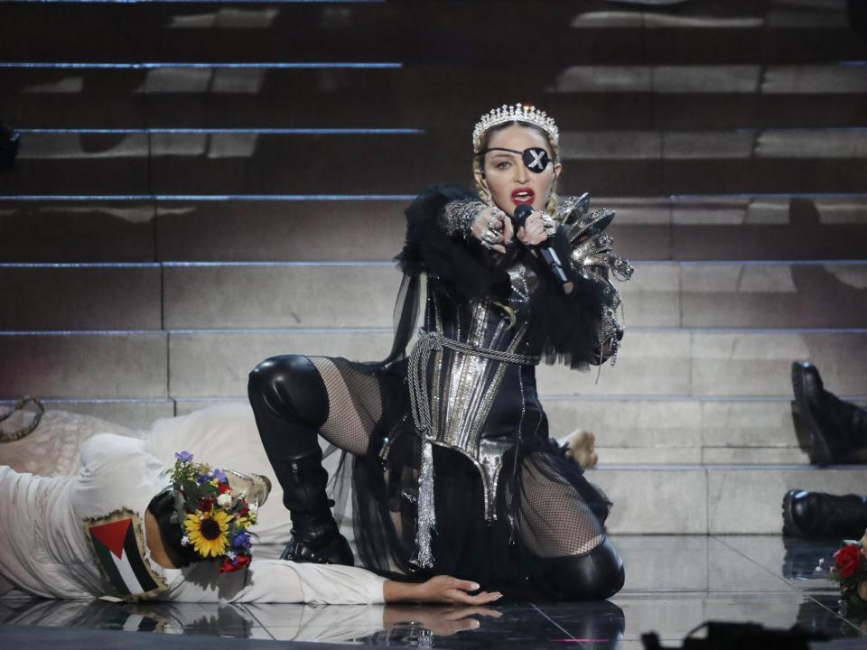 Madonna did not have permission to make a political statement about the Israel-Palestine conflict during her Eurovision performance, organisers have said.The pop star’s backing dancers were seen wearing Israeli and Palestinian flags on their backs during the performance at the final in Tel Aviv tonight.The European Broadcasting Union (EBU), which organises Eurovision,said it had not approved this part of the act because the event is “non-political”.Madonna had earlier defied calls from pro-Palestinian activists to cancel the show, saying beforehand that she wanted to create “a new path toward peace”.A spokesperson for the EBU told The Independent: “In the live broadcast of the Eurovision Song Contest grand final, two of Madonna’s dancers briefly displayed the Israeli and Palestinian flags on the back of their outfits.“This element of the performance was not part of the rehearsals which had been cleared with the EBU and the host broadcaster, KAN.“The Eurovision Song Contest is a non-political event and Madonna had been made aware of this.”Madonna began her performance by singing her 1989 hit “Like a Prayer” to raucous applause at Tel Aviv’s Expo venue.She then performed new song “Future”, a collaboration with Migos rapper Quavo who appeared on stage with her.Earlier in the night she appeared in a pre-recorded message, warning the public to not “underestimate the power of music to bring people together”.She said: “Look at all the delegates behind us, everyone here is from all over the world. So many countries that I have been privileged not just to visit but to experience.“And the one thing that brings me to those countries, and the thing that brings all these people here tonight, is music.”Madonna’s performance comes as she returns following a four-year hiatus.She is preparing to release Madame X, her 14th album, and earlier this month announced a world tour including a string of shows at the London Palladium.Additional reporting by agencies