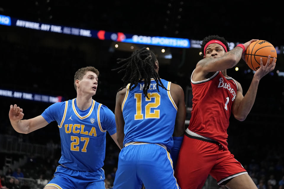 Ohio State' Roddy Gayle Jr. (1) looks to pass the ball during the first half of an NCAA college basketball game against UCLA Saturday, Dec. 16, 2023, in Atlanta, Ga. (AP Photo/Brynn Anderson)