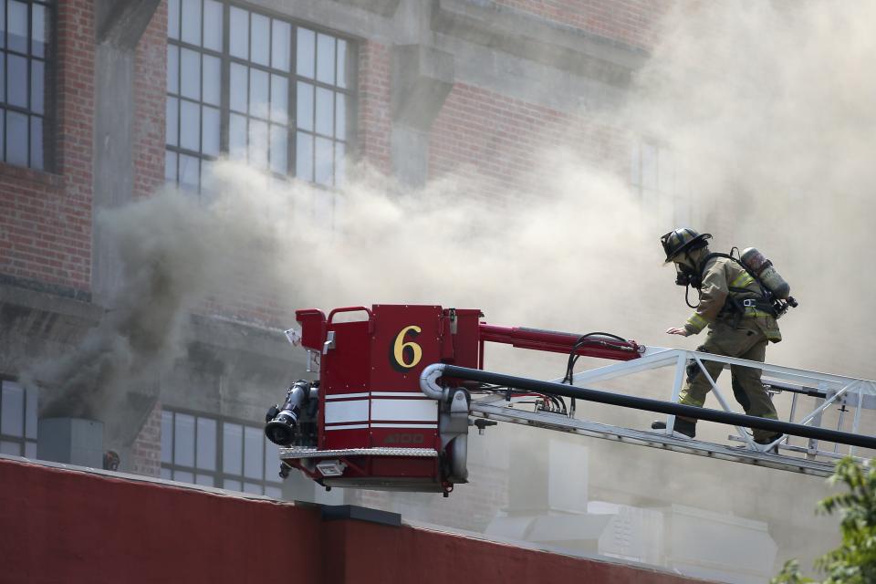 Oklahoma City firefighters respond Wednesday to a fire at the Buick Building in Oklahoma City.