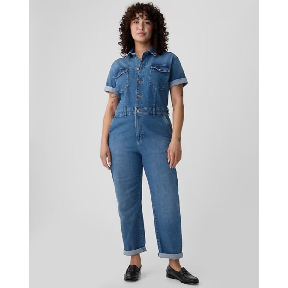 model wearing short sleeve denim jumpsuit coverall 