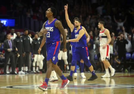 December 9, 2017; Los Angeles, CA, USA; Los Angeles Clippers guard Lou Williams (23) celebrates after scoring a game winning three point basket against the Washington Wizards during the second half at Staples Center. Mandatory Credit: Gary A. Vasquez-USA TODAY Sports