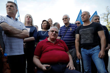 Serbian Radical Party leader Vojislav Seselj sits surrounded by supportes during a protest in the village of Jarak, near Hrtkovci, Serbia, May 6, 2018. REUTERS/Marko Djurica