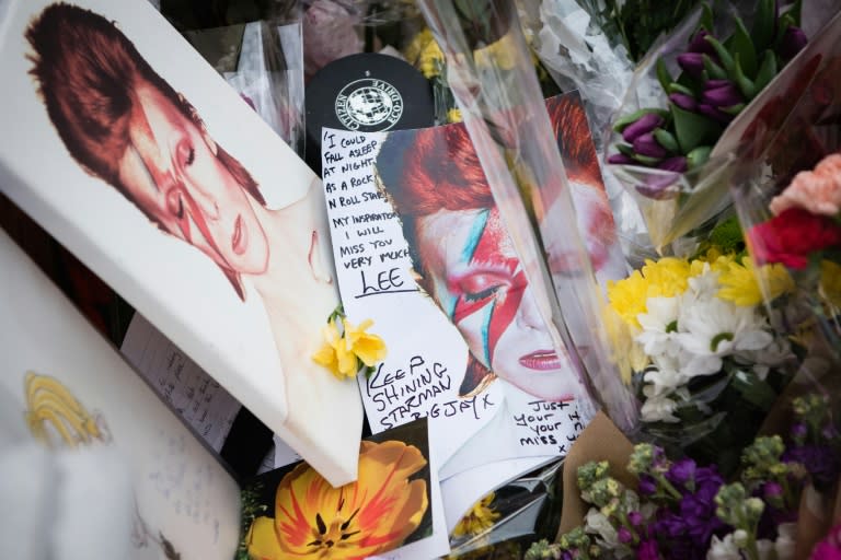 Tributes laid in homage to British singer David Bowie are seen in Brixton, south London, on January 12, 2016