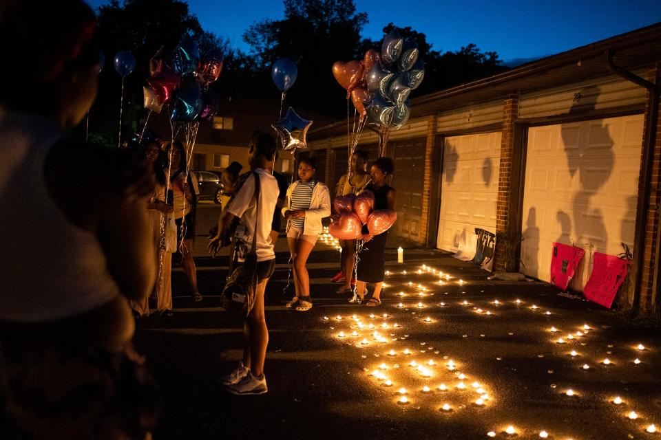 Family and friends gather Aug. 25, 2023 at a private candlelight vigil held for 21-year-old Ta'Kiya Young, a pregnant mother of two who was shot and killed by a Blendon Townshiup police officer a day earlier outside the Sunbury Road Kroger. Ta'Kiya was pregnant with a girl and due in November, according to family.