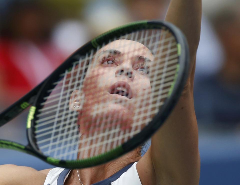 Flavia Pennetta of Italy serves to compatriot Roberta Vinci during their women's singles finals match at the U.S. Open Championships tennis tournament in New York, September 12, 2015. REUTERS/Mike Segar