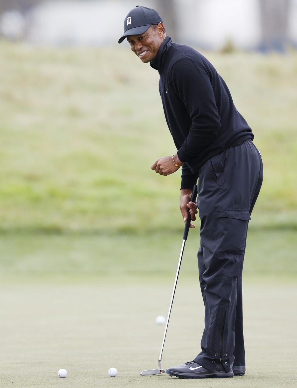 <p>Tiger Woods warms up during the final practice round for the 2020 PGA Championship golf tournament in San Francisco on Thursday. </p>