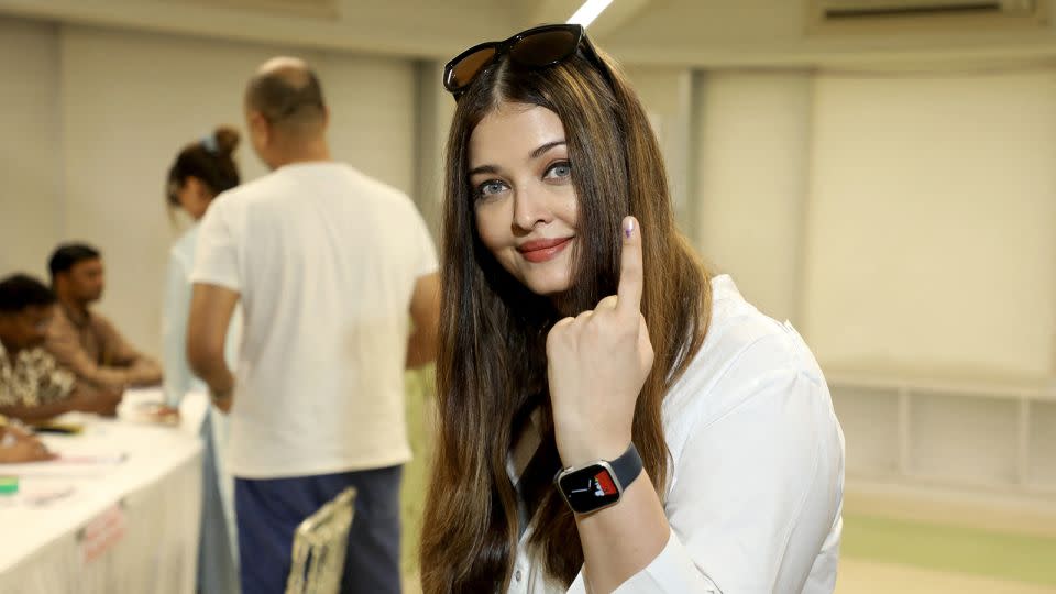 Bollywood actress Aishwarya Rai Bachchan shows her inked finger after casting her ballot at a polling station in Mumbai on May 20, 2024. - Stringer/AFP/Getty Images