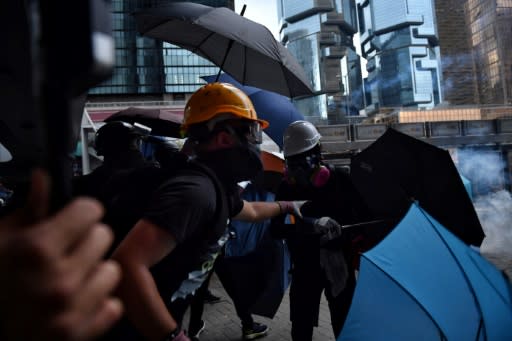 Unlike some of Hong Kong's braves who don reinforced gloves and body armour, Ryan chooses to dress in a simple black T-shirt