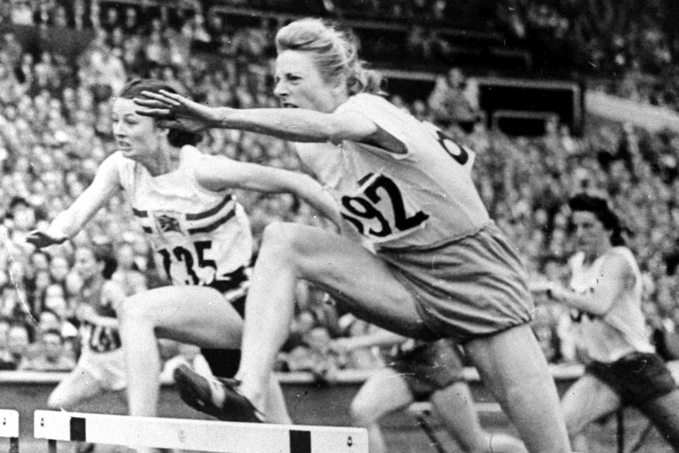 FILE - In this Aug. 4, 1948, file photo, Fanny Blankers-Koen of Holland,, leaps the last hurdle in the women's Olympic Games 80-metres hurdles Final at Wembley Stadium in London. Blankers-Koen was 30, the oldest woman among the track and field entries and considered past her prime. But she won the 100 and 200 meters, the 80-meter hurdles and the 4x100-meter relay. She remains the only female track and field athlete to win four gold medals at a single Olympics. (AP Photo/File)