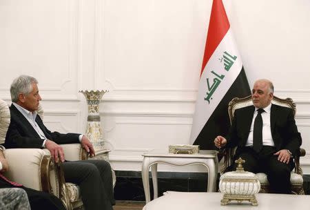 Defense Secretary Chuck Hagel meets with Iraqi Prime Minister Haider al-Abadi in Baghdad December 9, 2014. REUTERS/Mark Wilson/Pool