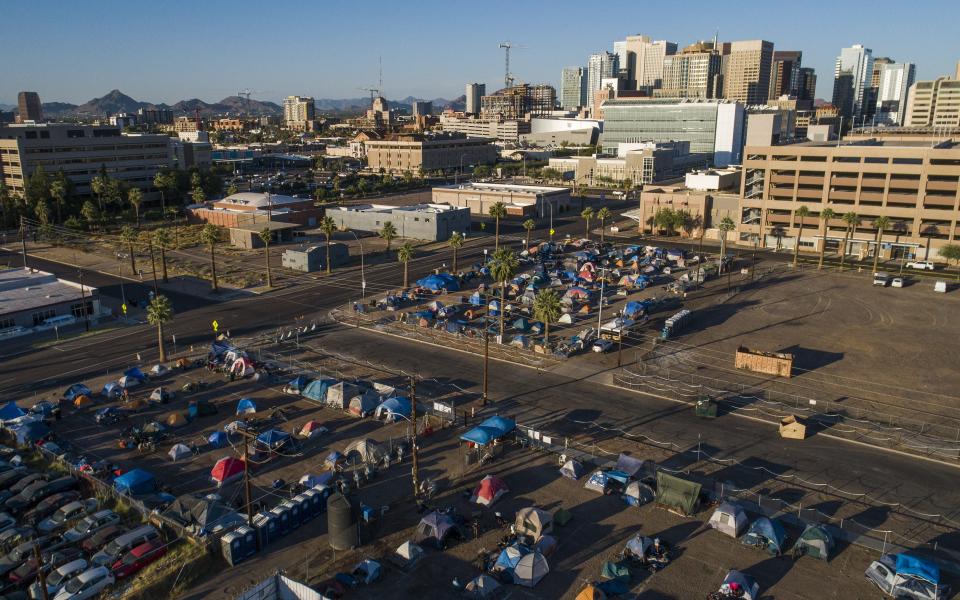 Homeless tents are erected in lots west of downtown Phoenix on May 27, 2020.