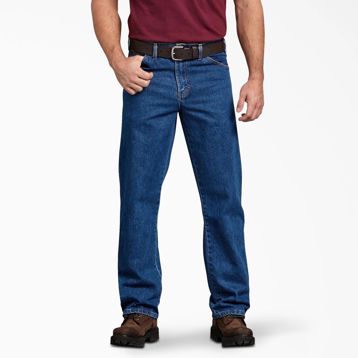 Model wearing Dickies regular-fit blue jeans for men.