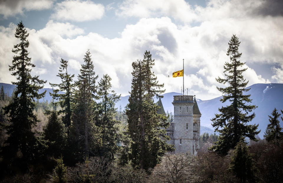 The Lion rampant flies at half mast at Balmoral Castle following the announcement of the death of Britain's Prince Philip, in Aberdeenshire, Scotland, Friday, April 9, 2021. Prince Philip, the irascible and tough-minded husband of Queen Elizabeth II who spent more than seven decades supporting his wife in a role that both defined and constricted his life, has died, Buckingham Palace said Friday. He was 99. (Jane Barlow/PA via AP)