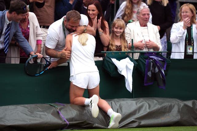 Sonay Kartal hugs someone in the stands after her victory