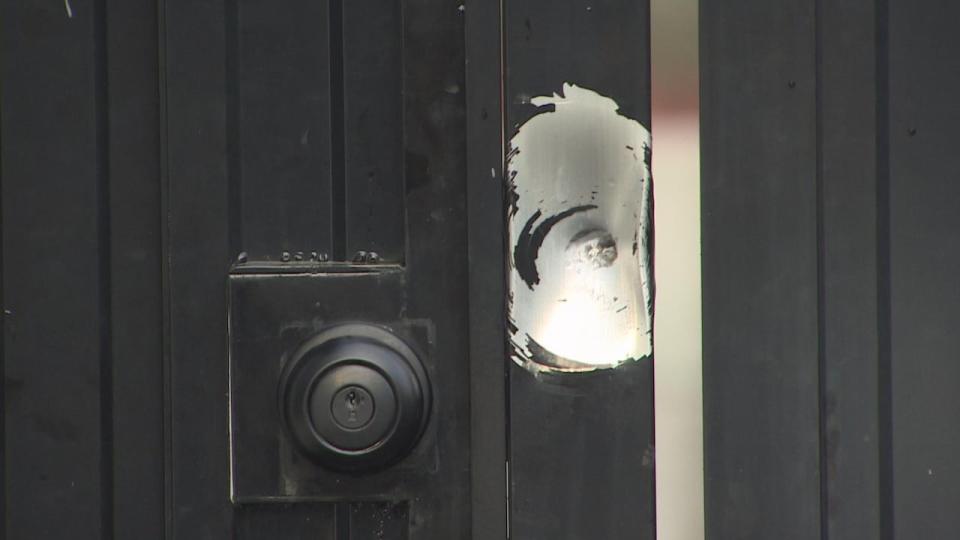 Kumar says his family is disturbed and concerned for their safety amid rising gun violence in Surrey, including at his son's home where an apparent bullet hole on his gate is pictured on Dec. 31, 2023.