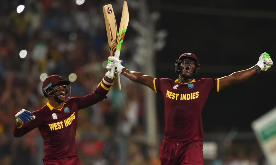 <span>Carlos Brathwaite (right) celebrates after helping West Indies win the T20 World Cup in 2016.</span><span>Photograph: Dibyangshu Sarkar/AFP/Getty Images</span>