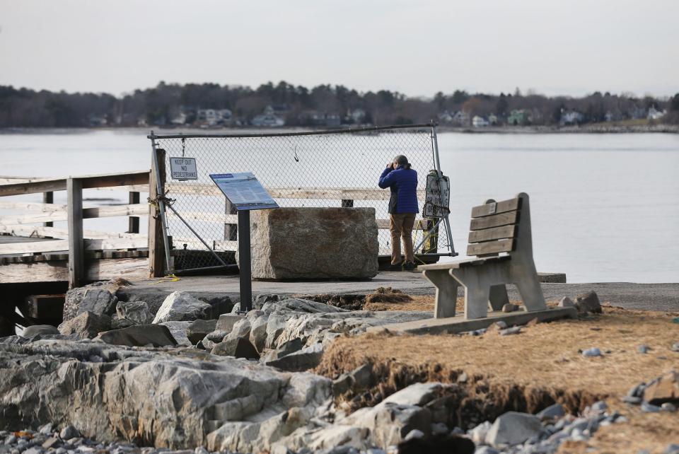 Judy Spiller, chair of Kittery's Town Council, on Thursday, Jan. 25, 2024, assesses the pier at Fort Foster and possible damage it sustained from recent storms.