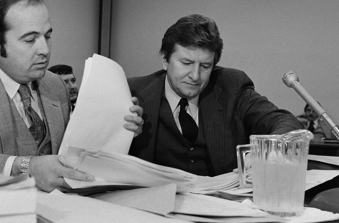 In this 1980 photo, then-Rep John Jenrette goes over paperwork with his attorney Kenneth Robinson before one of a series of House Ethics committee hearings.