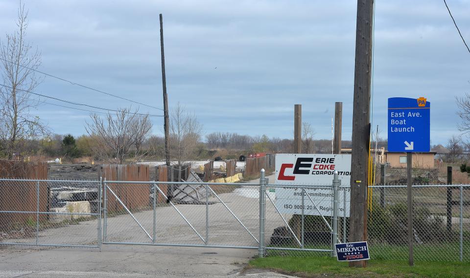 New fencing surrounds the site of the former Erie Coke Corp. plant, at the foot of East Avenue, shown this spring.