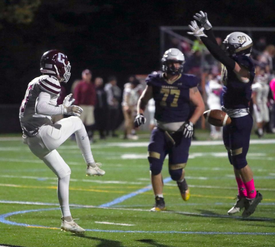 Delaware Military's Jordan Holden (right) blocks a punt by Concord's Jackson LaPerle before recovering the ball in the end zone in the third quarter of the Seahawks' 45-6 win at Fusco Memorial Stadium at Delaware Military Academy, Thursday, Oct. 19, 2023.