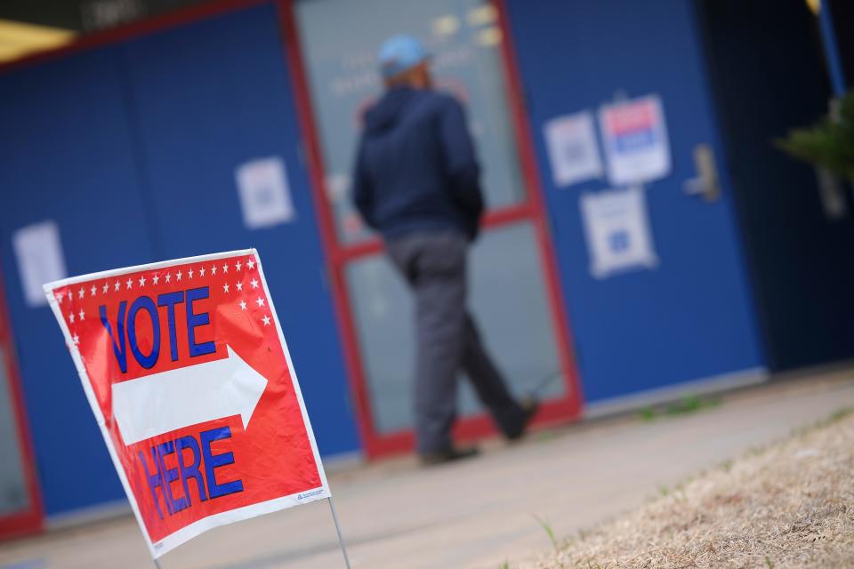 Voters cast their ballots on SQ 820 at the Millwood Field House for precincts 429 and 431 Tuesday, March 7, 2023