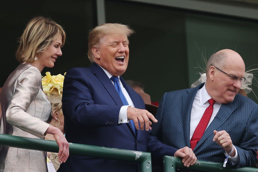 Donald Trump laughs while attending the 2022 Kentucky Derby in Louisville, Ky (Getty Images)