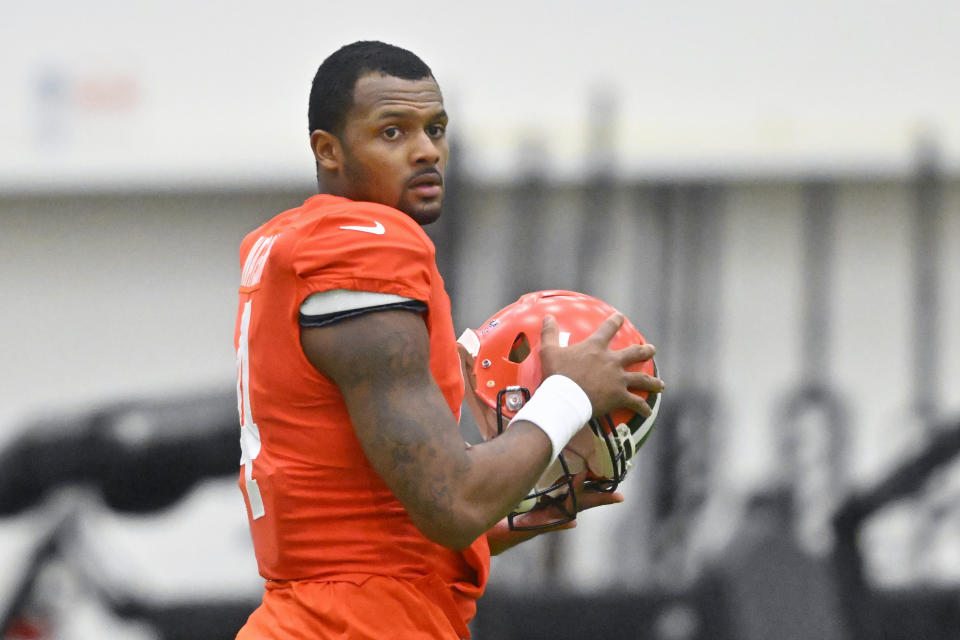 Cleveland Browns quarterback Deshaun Watson stands on the field during an NFL football practice at the team's training facility Wednesday, Nov. 30, 2022, in Berea, Ohio. (AP Photo/David Richard)