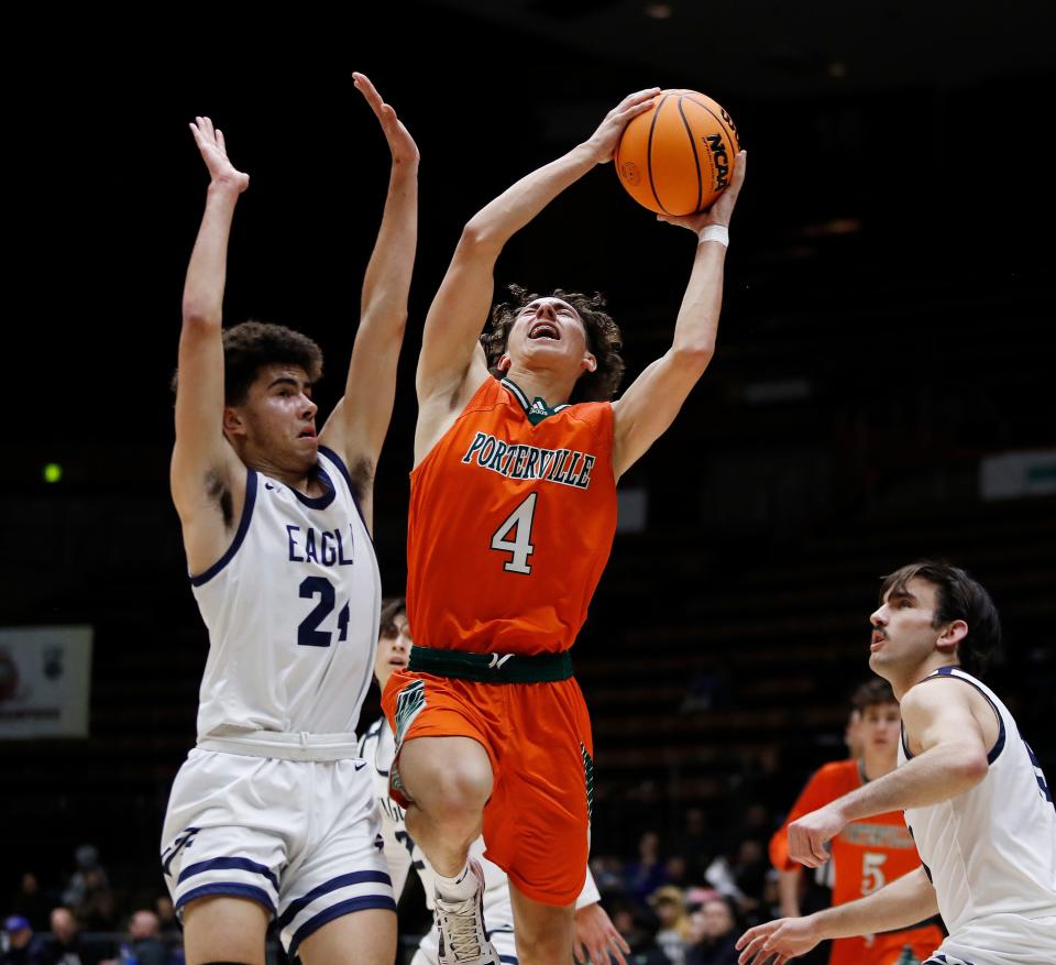 Porterville's Andrew Moody drives against Arroyo Grande during their Central Section Division II Boys Championship game at Selland Arena in Fresno, Calif., Friday, Feb. 24, 2023.