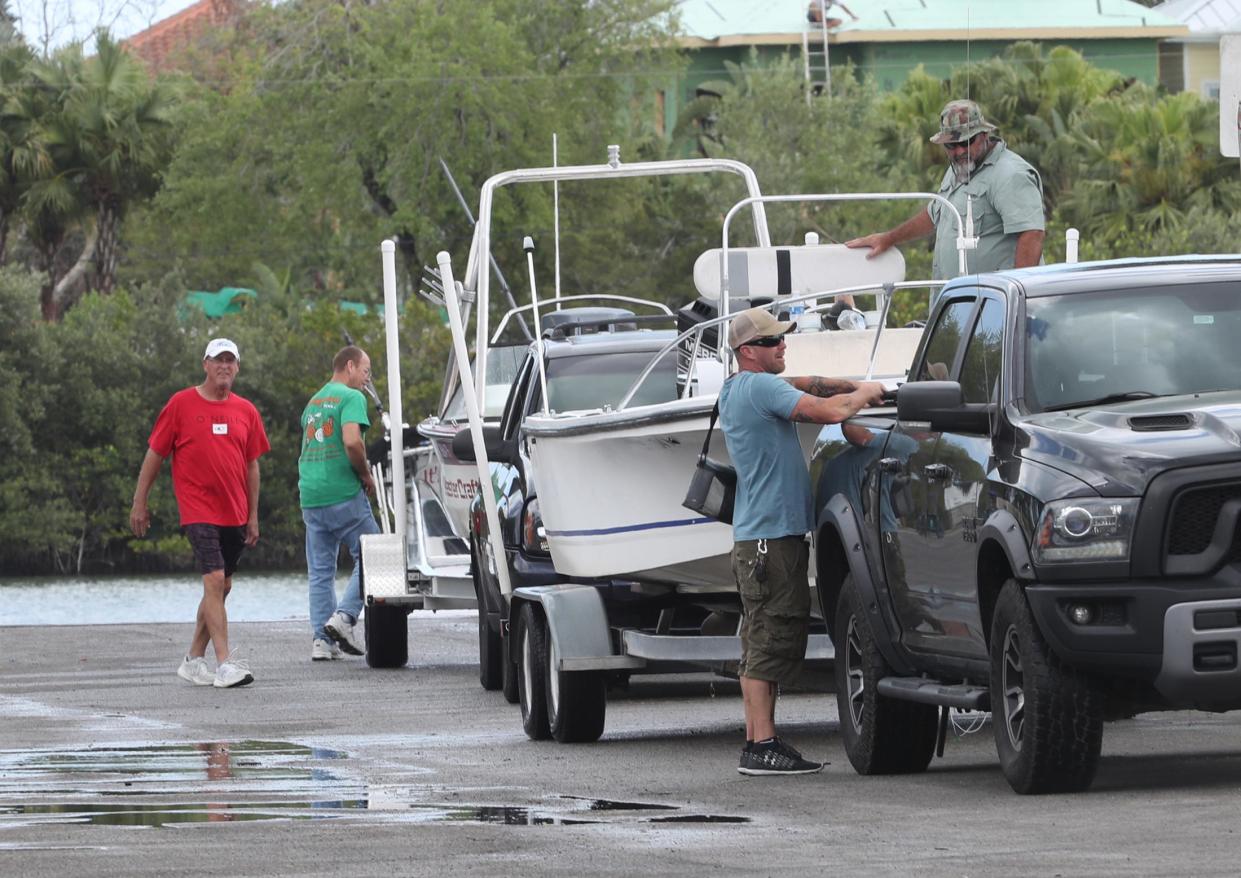 Boaters stow their gear after pulling their craft out of the water at the North Causeway boat ramp.